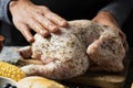 Young man preparing a turkey