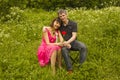 Young man presents red rose to young woman Royalty Free Stock Photo