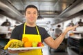 Young man presents a tray of fruit Royalty Free Stock Photo