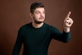 Young man pressing virtual button