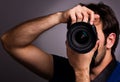 Young man with professional camera Royalty Free Stock Photo