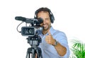 Young man with professional movie camera Royalty Free Stock Photo