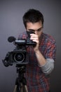 Young man with professional video camcorder Royalty Free Stock Photo