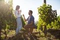 Young man proposing girlfriend at vineyard Royalty Free Stock Photo
