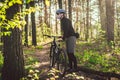 Young man in protective mask from environmental pollution riding mountain bike on cross country road. Cyclist Riding the Bike on Royalty Free Stock Photo