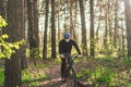 Young man in protective mask from environmental pollution riding mountain bike on cross country road. Cyclist Riding the Bike on Royalty Free Stock Photo