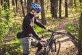 Young man in protective mask from environmental pollution riding mountain bike on cross country road. Cyclist Riding the Bike on Royalty Free Stock Photo