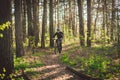 Young man in protective mask from environmental pollution riding mountain bike on cross country road. Cyclist Riding the Bike on Royalty Free Stock Photo