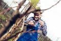 Young man pruning branches of fruit tree in springtime Royalty Free Stock Photo