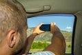 A young man pulling hairy hand into the window Royalty Free Stock Photo