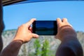 A young man pulling two hairy hands into the open window of a mo Royalty Free Stock Photo