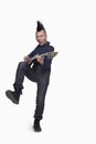 Young man with punk Mohawk playing guitar Royalty Free Stock Photo