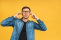 Young man put hands to his head. He feeling sick and headache or having some problems. His stress makes him uncomfortable and Royalty Free Stock Photo