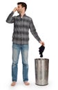 Young man putting dirty socks in a laundry basket Royalty Free Stock Photo