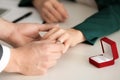 Young man putting engagement ring on fiancee's finger Royalty Free Stock Photo