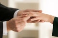 Young man putting engagement ring on fiancee's finger Royalty Free Stock Photo