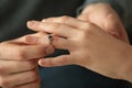 Young man putting engagement ring on fiancee's finger, closeup Royalty Free Stock Photo