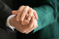 Young man putting engagement ring on fiancee\'s finger, closeup Royalty Free Stock Photo