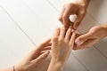 Young man putting engagement ring on fiancee's finger, closeup Royalty Free Stock Photo