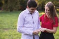 Young man putting the engagement ring on his girlfriends finger Royalty Free Stock Photo