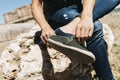 Young man putting on or taking off his shoe Royalty Free Stock Photo