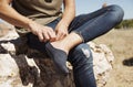 Young man putting on or taking off his sock Royalty Free Stock Photo