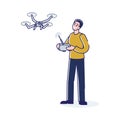 Young man with quadrocopter or drone. Guy holding remote controller of drone hovering in the sky Royalty Free Stock Photo