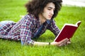 Young man read book in grass Royalty Free Stock Photo