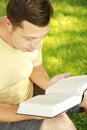 Young man reading the Bible Royalty Free Stock Photo