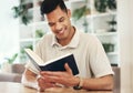 Young man reading bible for religion, faith and god knowledge, studying or research at home. Faith, hope and christian Royalty Free Stock Photo