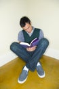 Young man reading book