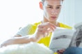 Handsome male focused reading a book