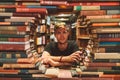 Young man reading a book in the Last Book Store in LA. Royalty Free Stock Photo