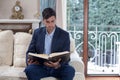 Young man reading a book