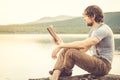 Young Man reading book outdoor Royalty Free Stock Photo