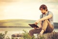 Young Man reading book outdoor Lifestyle Royalty Free Stock Photo