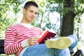 Young man reading a book