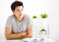 young man reading book and thinking Royalty Free Stock Photo