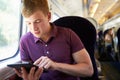 Young Man Reading A Book On Train Journey Royalty Free Stock Photo