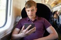 Young Man Reading A Book On Train Journey Royalty Free Stock Photo