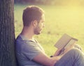 Young man reading e-book Royalty Free Stock Photo