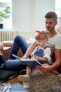 Young man reading with a little girl. father and daughter concept