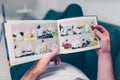 Young man reading a Moomin book Royalty Free Stock Photo