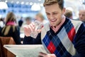 Young man reading newspaper at cafe Royalty Free Stock Photo