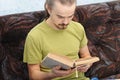 Young man reading vintage book