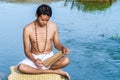 Young man reads ancient scripture.