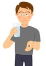 Young man is ready to take pills holding a glass of water