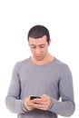 Young man receiveing a surprising sms Royalty Free Stock Photo