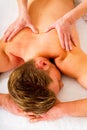 Young man receives massage Royalty Free Stock Photo