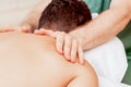 Young man receiving back massage Royalty Free Stock Photo